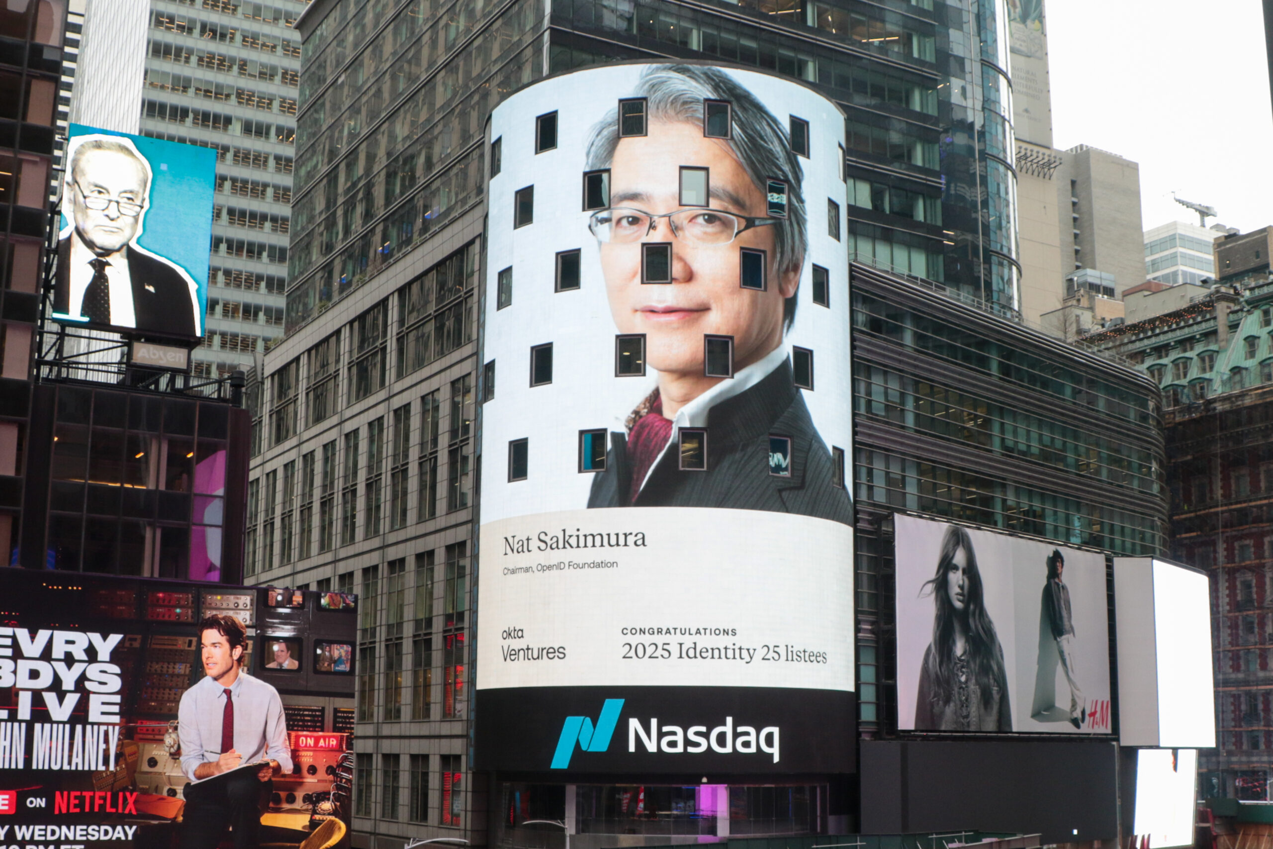 Nat Sakimura displayed on the wall of the Nasdaq building at NY Times Square.